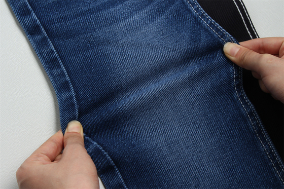 12 oz preço acentuado baixo estiramento denim tecido para o homem trabalho usar jeans traseiro preto preço competitivo de Weilong têxtil