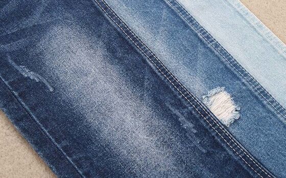 Tecido de denim de algodão 100% de alta qualidade. Denim pesado clássico para casaco de jeans.