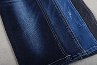 Sarja magro do assistente das calças de brim RHT das mulheres azuis Stretchable enormes tela da sarja de Nimes de 10 onças