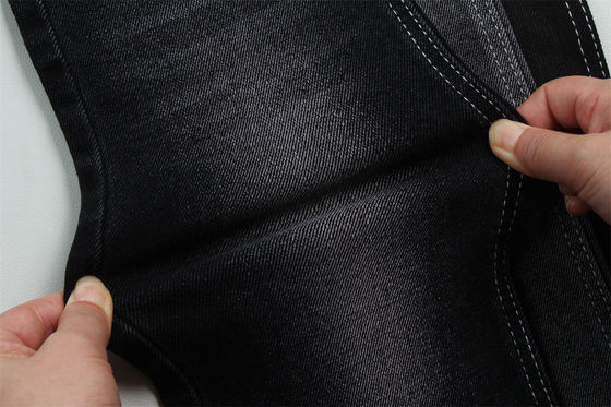 Bom preço 11 oz tecido de denim de baixo alongamento para o trabalho do homem usar jeans traseiro preto preço competitivo de Weilong Textile on-line