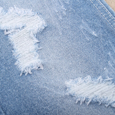 Bom preço Tecido de algodão rígido de denim 100% para jeans e vestuário on-line